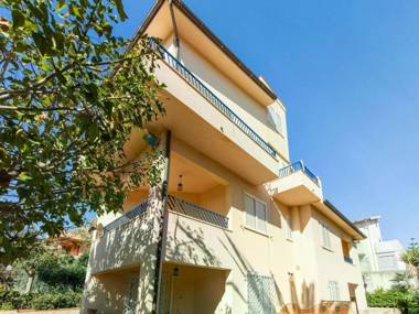 A sun-drenched holiday apartment just a few metres from the Sicilian coastline