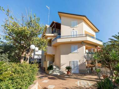 A sun-drenched holiday apartment just a few metres from the Sicilian coastline