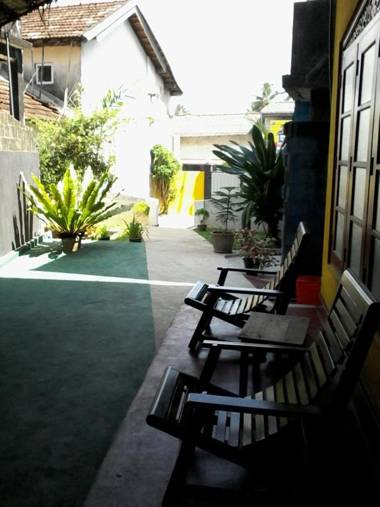 Malika's Yellow House