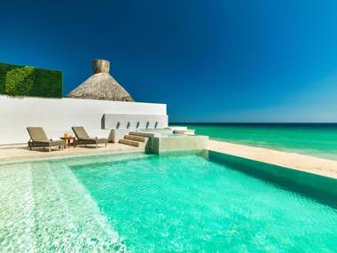 Ultra Exclusive Beachfront Villa Just Steps from the Sand with Butler Included