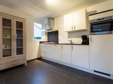 Luxurious villa with washer and dishwasher in a green area