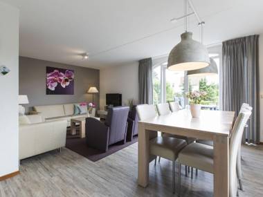 Luxurious villa with microwave within green surroundings