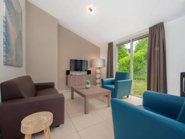 Modern bungalow with washing machine in green surroundings