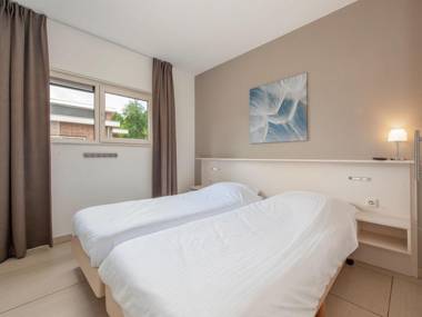 Modern bungalow with washing machine in green surroundings