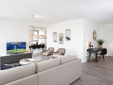 Penthouse apartment with a spacious terrace and a view over the North Sea