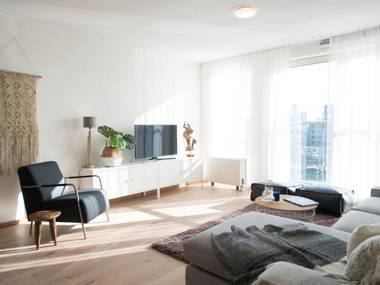 Modern apartment balcony overlooking exclusive seaworthy yachts