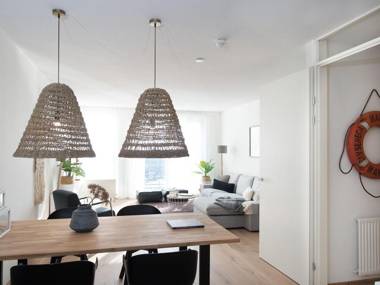 Modern apartment balcony overlooking exclusive seaworthy yachts