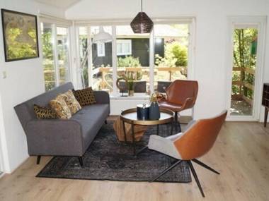 Atmospheric house on the water surrounded by nature