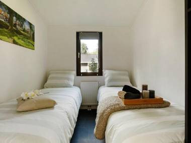 Atmospheric house on the water surrounded by nature