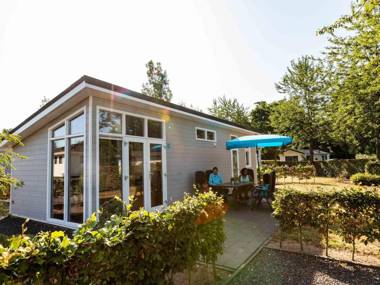 Modern light chalet with WiFi in a water-rich area