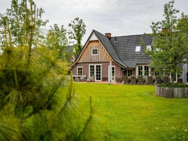 Beautiful house with a fireplace surrounded by nature