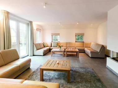 Beautiful house with a fireplace surrounded by nature