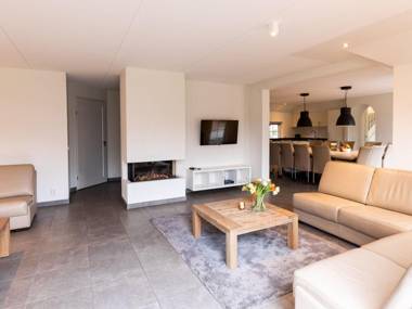 Beautiful house with a fireplace surrounded by nature