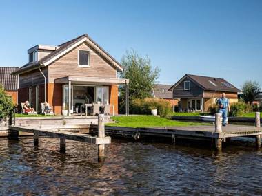 Stylish modern holiday home with a terrace by the water