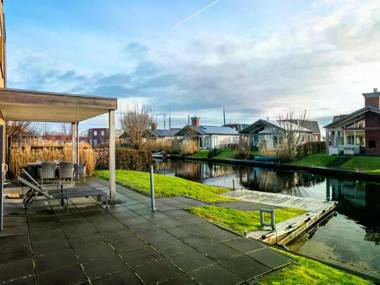 Stylish modern holiday home with a terrace by the water