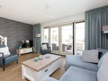 Stylish modern holiday home with a terrace by the water