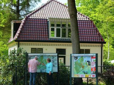 Characteristic house with a garden surrounded by forest