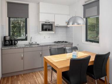 Engaging chalet with dishwasher next to a nature reserve