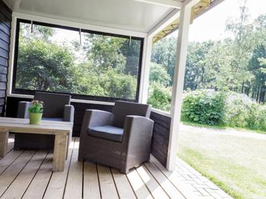 Nice tentlodge with roofed terrace in a green area