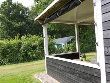 Nice tentlodge with roofed terrace in a green area