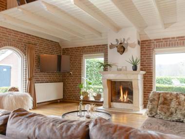 Cozy farmhouse with a decorative fireplace close to nature