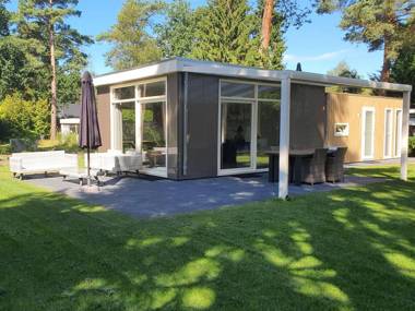 Comfy chalet with sunshower located in a forrest