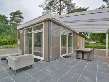 Comfy chalet with sunshower located in a forrest