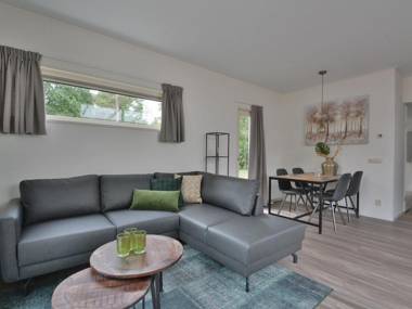 Comfy chalet with sunshower located in a forrest