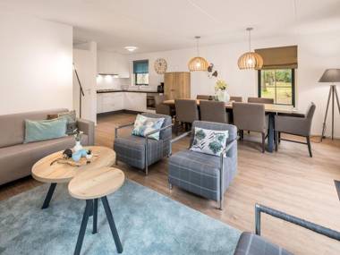 Luxurious villa with sun shower in a wooded area