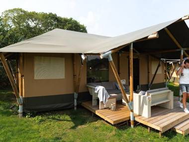 Striking tent lodge with a porch located near the Veluwe