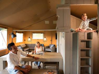 Striking tent lodge with a porch located near the Veluwe