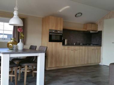 Combined chalets with a bathroom located near a pond