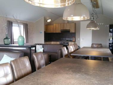 Combined chalets with a bathroom located near a pond