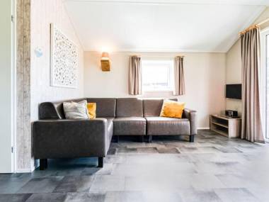 Beautiful home with a veranda and jetty located near a pond