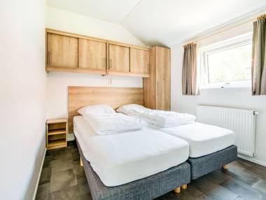 Beautiful home with a veranda and jetty located near a pond