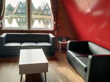 Cozy cottage with a spacious garden around a fishing pond