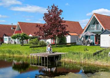 Lilian Modern Holiday home at a typical dutch canal close to the Lauwersmeer