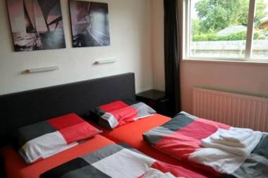 4 pers Mia Holiday home with lake view in front of the Lauwersmeer