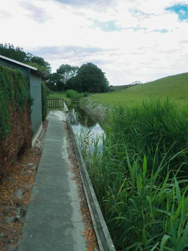 am Deich 6 pers House with a private terrace behind a dike by the Lauwersmeer