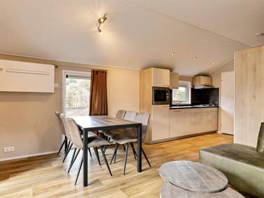 Luxurious lodge with airco located beside a lake