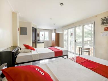 Vaccinated Staff - OYO 842 City Smiles Apartelle