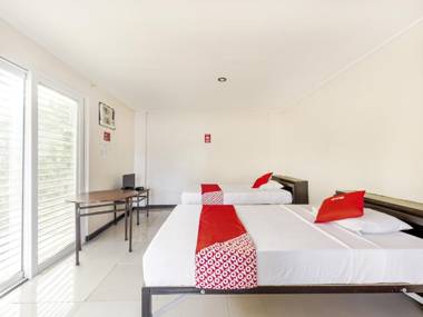 Vaccinated Staff - OYO 842 City Smiles Apartelle