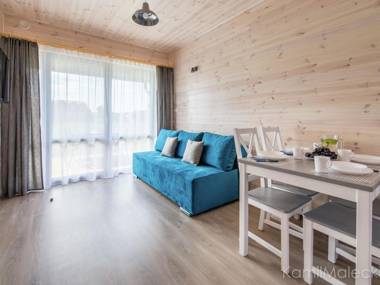 Comfortable apartment in a wooden cabin by the sea in Krynica Morska