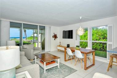 LaPlaya 101A Step out to the beach from your screened lanai Light and bright end unit