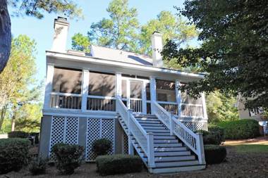 Enjoy our outdoor Tv and screened porch at Marina Cottage