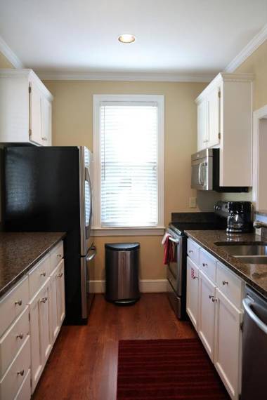 Enjoy our outdoor Tv and screened porch at Marina Cottage