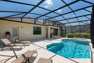 Victoria Villa- Modern 4 bedroom villa with a fully screened private pool with spa game room gas BBQ and resort amenities