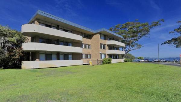 Right on the sands at Little Beach and walk to the heart of Nelson Bay