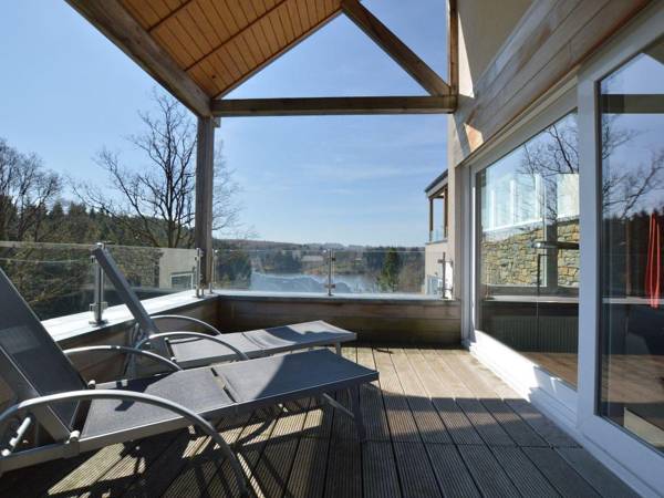 Luxury holiday apartment with a sauna fireplace and views over a lake