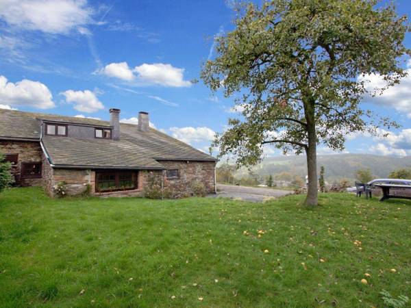 Semi-detached farm situated at the edge of the woods